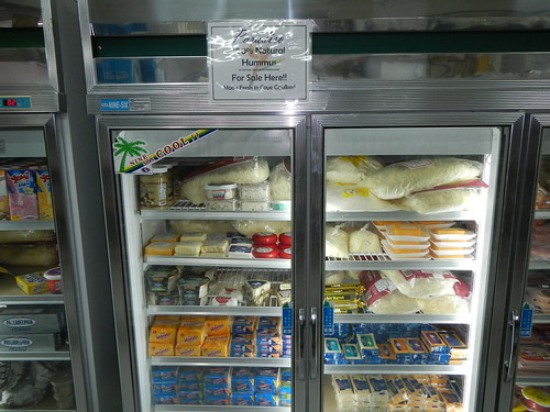 Imported cheese in refrigerated display at supermarket