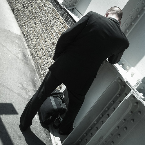 man in suit with bag by mdx