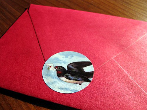 Letterbird seal on red envelope