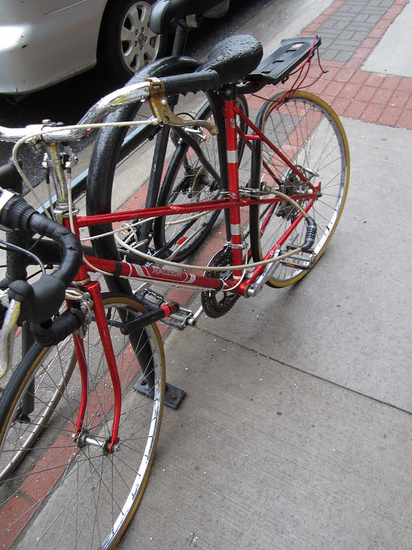 Image of Red Raleigh Mixte bike