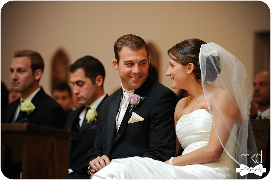 Bride & Groom smiling at each other during ceremony