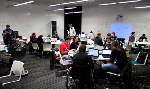 The room full of busy hackers