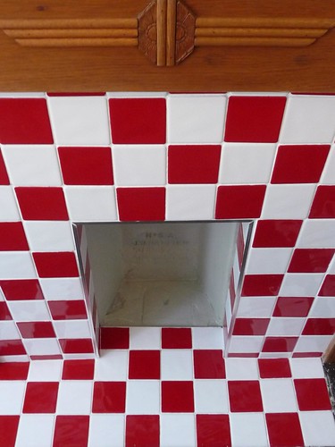 Red and white tiled fireplace