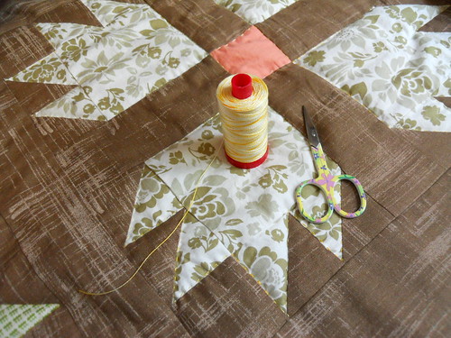 hand quilting with variegated Aurifil 12 wt