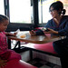 Val Wang interviews a young customer at Peking House, Dudley Square, Roxbury posted by Planet Takeout to Flickr