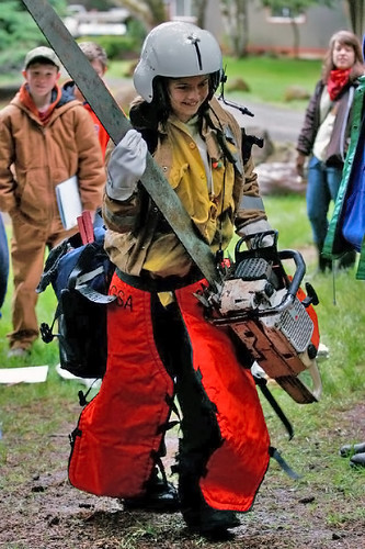 A camper is tested to see if she has what it takes to suit up to be a firefighter in the Wildland Fire class near Alsea, Ore., April 12, 2012. Some165 sixth-grade students from several small schools attended this year’s Forest Camp Outdoor School. (USFS photo/Jenny Bocko)