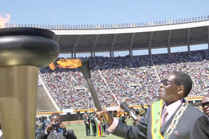 Republic of Zimbabwe President Robert Mugabe lights the torch commemorating the 32nd anniversary of national independence of this Southern African nation. Zimbabwe won its freedom from British imperiaism in 1980. by Pan-African News Wire File Photos
