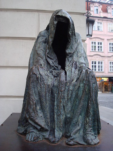 The haunting hooded figure in Prague is labeled “Il Commendatore,” from Mozart’s Don Giovanni.