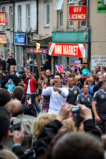 A fireman, Tony Burton, carried the Olympic Torch up Mill Rd
