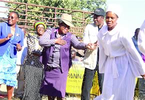 Zimbabwe Vice-President Joice Mujuru and Media, Information and Publicity Minister Webster Shamu, and his wife (second from left) join members of Chiedza Chavatendi Apostolic sect on the dance floor during a field day in Chegutu on July 8, 2012. by Pan-African News Wire File Photos