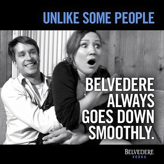 the Belvedere ad in question that pictures a young woman who looks horrified being pulled into the lap of a smiling young man. the text reads Unlike some people, Belvedere always goes down smooth