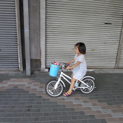 Young girl cycling Kyoto