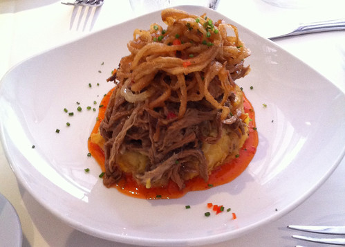 Ropa vieja with plantain fufu and fried onions
