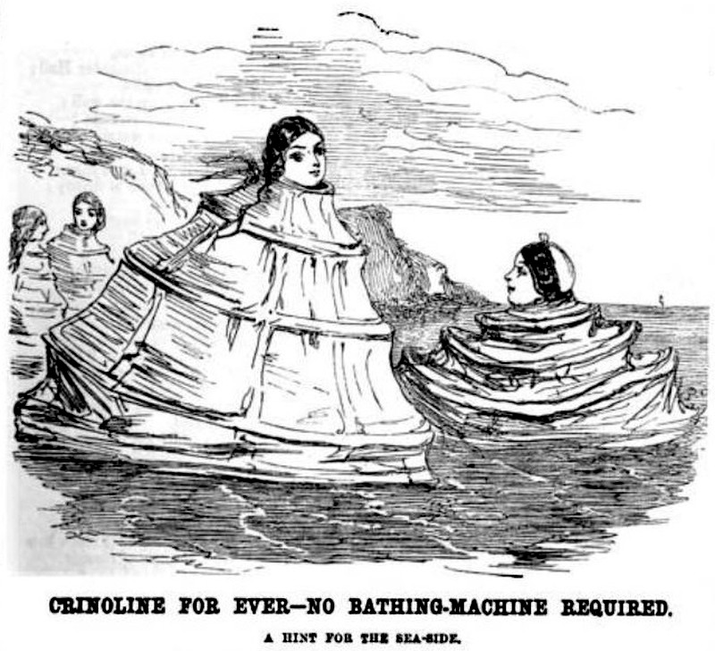 Two women are shown sea-bathing while wearing crinoline petticoats around their necks as a substitute for bathing tents
