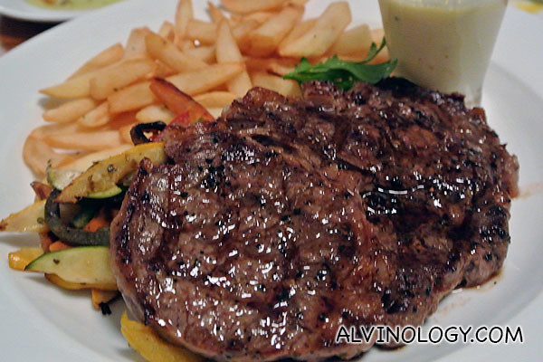 Entrecôte: Grilled grain-fed Beef Rib-eye 280gm with ‘La Villa Butter sauce’ Fries and Market Vegetables