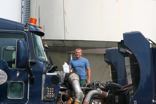Montana checks the trucks oil and water levels