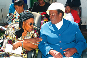 Former Zimbabwe Vice President Simon Muzenda’s widow Amai Maud Muzenda (right) talks to Cde Emmy Ncube during a meeting of female ex-combatants in Harare last week. by Pan-African News Wire File Photos