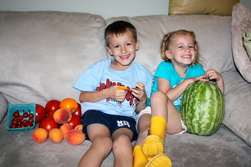 Kids-on-couch-with-market-stuff