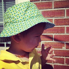 The green side of the bucket hat.