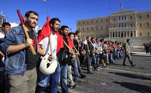 Greek workers march through Athens amid the imposition by a right-wing government of further austerity measures. The world economic crisis of capitalism has rendered millions to unemployment and poverty. by Pan-African News Wire File Photos