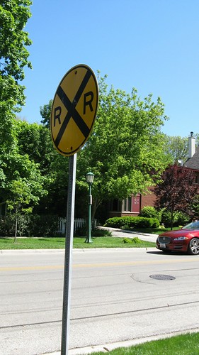 Standard railroad crossing ahead sign on Isabella Street.  Wilmette Illinois.  May 2012. by Eddie from Chicago