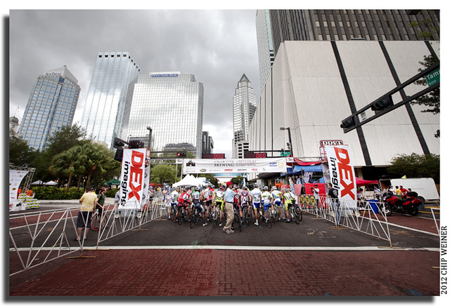 Mens 30 plus race  gathers at the starting line under dark skies in downtown Tampa