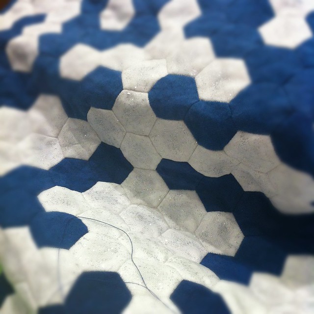 Close up of Cathy's sparkly snowflake quilt