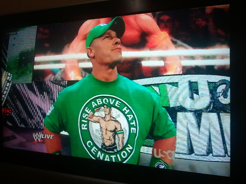 There is something about John Cena wearing a shirt with his shirtless image on it
