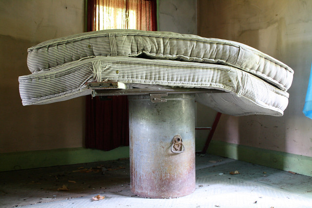 The mattresses perform a balancing act atop a metal drum.