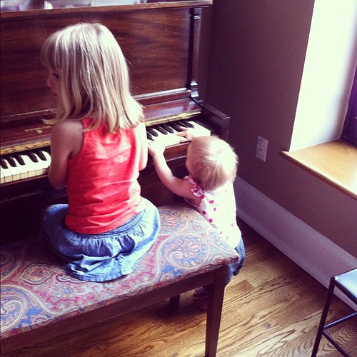 Piano sisters. (My sister's apartment is so not kid-proofed.)