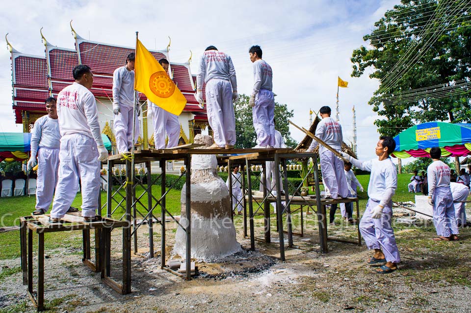 Preparation on pouring "Gold" to make buddha statue @ Wat Bo Rahaeng, Kanchanaburi, Thailand