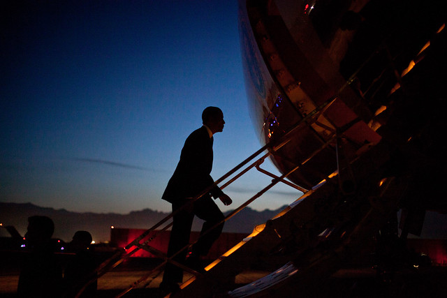 image of President Obama boarding Air Force One at twilight