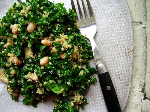 quinoa salad with kale, navy beans, and caramelized onions