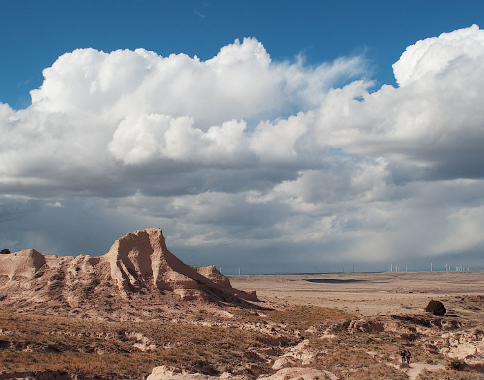 sandy rugged buttes rising under a dramatic stormy spring sky on the High Plains of Colorado