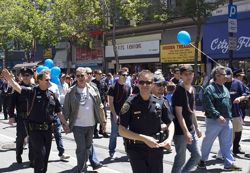 SFPD officers and their loved ones, some walking hand in hand