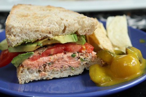 Salmon Salad Sandwich with Avocado, Tomato, Chips, and Mustard Pickles