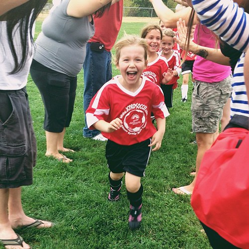 The parent tunnel is by far her favorite part of #soccer.