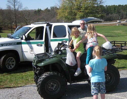 Officer Derik Breedlove gives potential future Forest Service law enforcement officers an opportunity to try out the view from an ATV seat.  Photo credit: USDA Forest Service/Stuart Delugach
