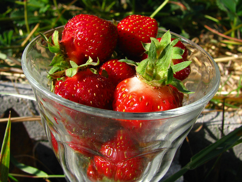 A glass full of strawberries.