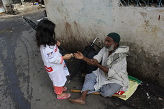 Marziya gives alms to the muslim beggar by firoze shakir photographerno1