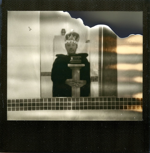 reflected self portrait with Polaroid Image System camera and delusions of grandeur by pho-Tony