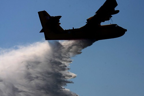Fire fighting aircraft dropping sea water on a forest fire near Thessaloniki, Greece by Teacher Dude's BBQ