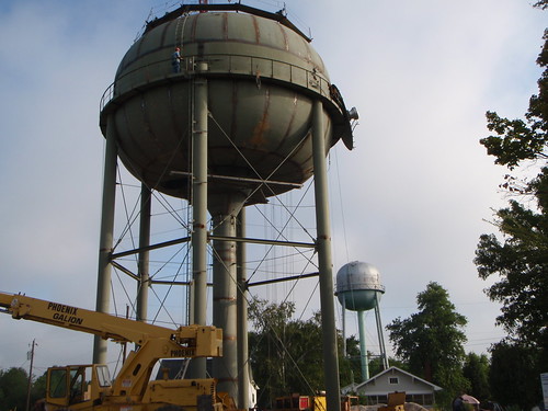 The new Oakland City water tower (foreground) under construction.  The old tower is shown behind the new one. 