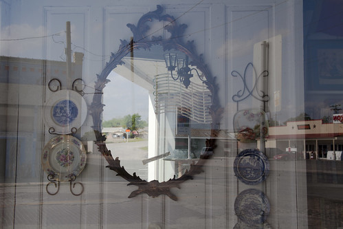 A mirror displayed in a shop window in Bartlett, Texas.