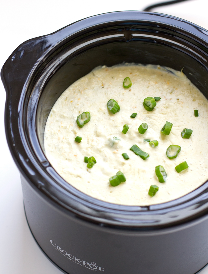5 Ingredient Slow Cooker Queso Dip - Toss is all in and sit back because this dip is going to make itself! #queso #quesoblanco #slowcooker #crockpot #salsaverde | littlespicejar.com