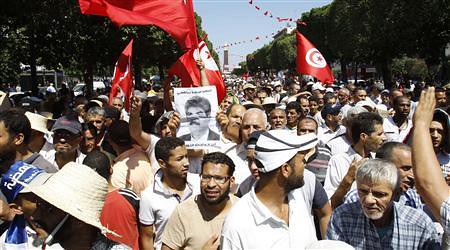 Tunisians protest after Mohamed Brahmi's assassination. Two days of demonstrations have called for the resignation of the Islamist government. by Pan-African News Wire File Photos