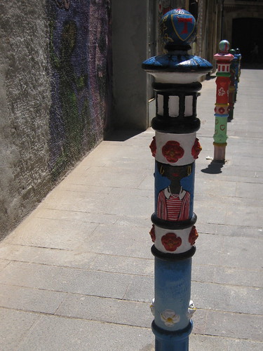 Painted poles lining the streets of Tarragona. From Three Day Trips from Barcelona