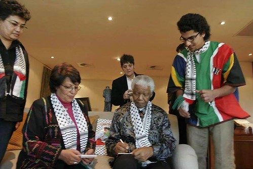 Nelson Mandela with members of the Popular Front for the Liberation of Palestine (PFLP). Mandela has been eulogized by the Palestinians. by Pan-African News Wire File Photos