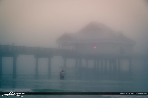 Couples in the Foggy Water at Clearwater Pier Pinellas County Florida by KimSengPhotography