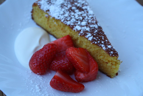 a wheat free almond and orange cake with local French strawberries and crème fraiche